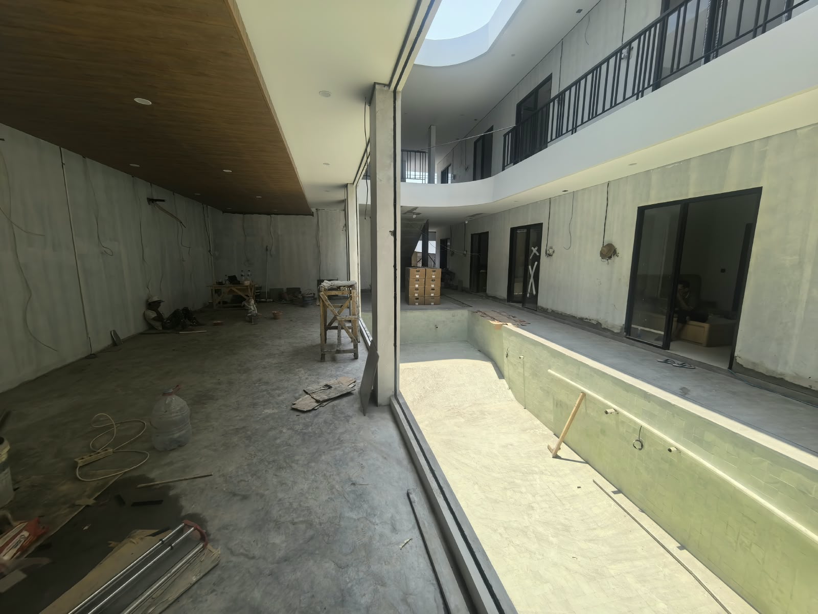 HAVN's ground-floor pool shell and two-storey walkways during building finishing, October 2026